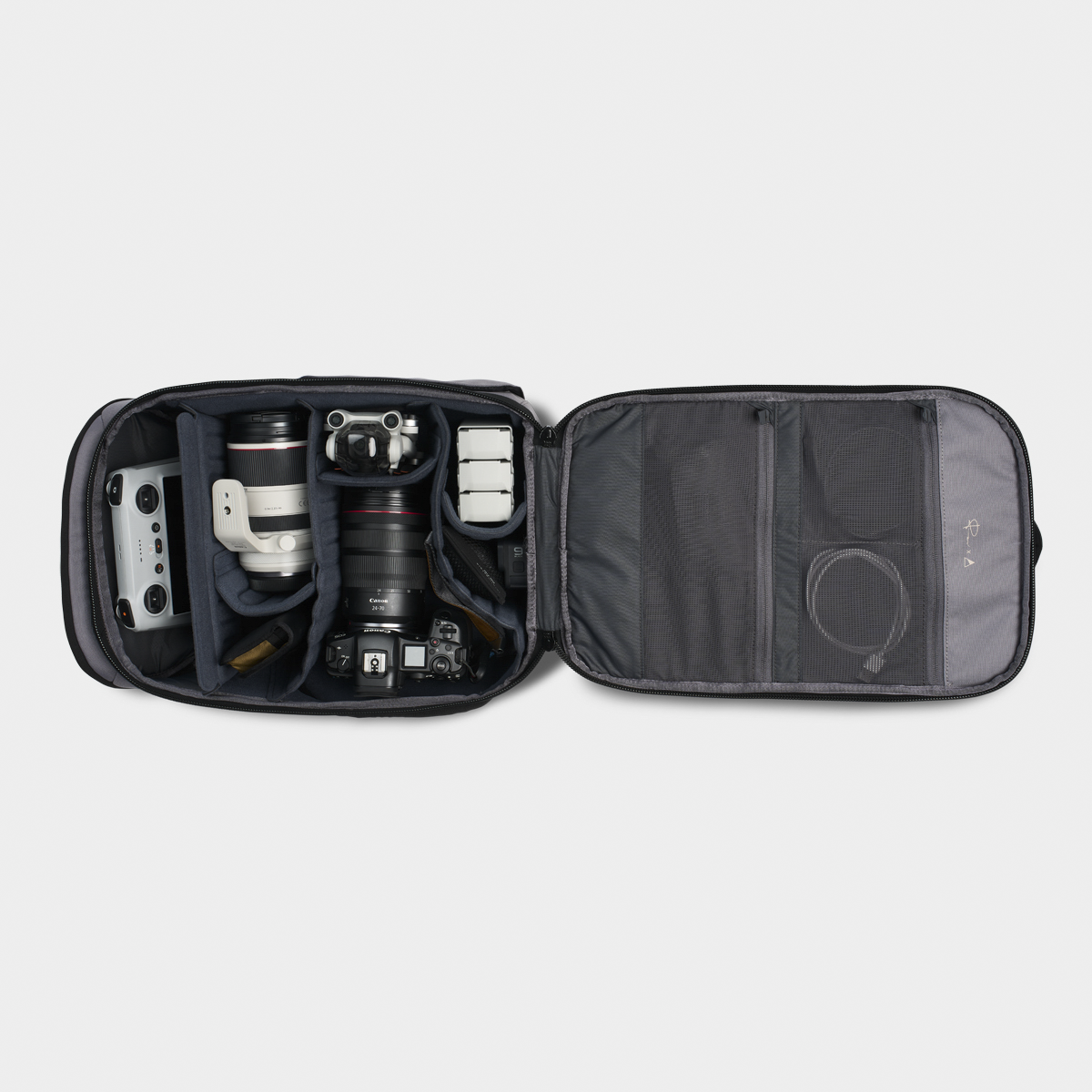 Luma Camera Pack 18L Open with Items and Camera Gadgets Inside #color_stone