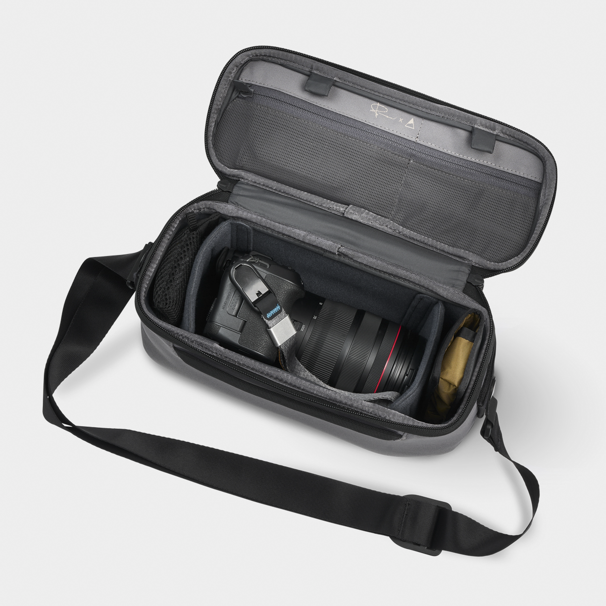Stone Luma Camera Sling 9L With Items Inside View #color_stone
